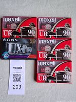 Front view showing four Maxell UR 90 and one Sony UX-Pro 90 sealed tapes