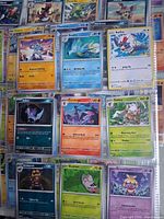 Binder page showing English cards: Horsea, Seadra, Rufflet, Zubat, Ceruledge, Shiftry, Krokorok, Snom, Smoochum and others