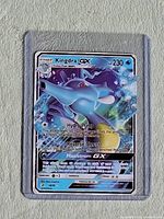 Front of Kingdra-GX Full Art Holofoil card in toploader