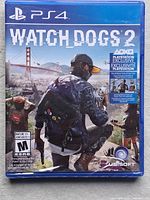 Front view of sealed Watch Dogs 2 PS4 case showing cover art and ratings