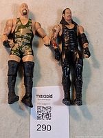 Both WWE action figures side by side with lot card