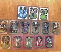 All 14 cards laid out in protective toploaders.