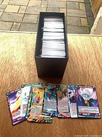 Deck box filled with card stack and sample cards displayed