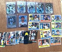 Overview of entire lot showing 26 cards in various configurations