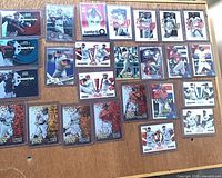 Overall view of all 28 sleeved and top-loaded insert cards on table