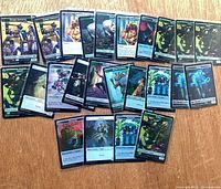 All 32 sleeved foil token cards spread out