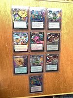 Front view of 10 toploaders containing all 20 cards