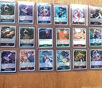 Front view showing 18 sleeved foil rare One Piece character cards