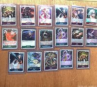 Front view showing 18 of the sleeved holographic cards on tabletop