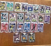 All 24 sleeved Panini Absolute football cards laid out showing fronts