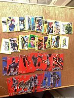 Spread of yellow-border mini cards and red-border base cards on tabletop