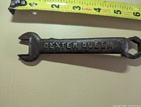 Wrench front showing DEXTER QUEEN cast lettering and open jaw