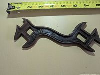Full view of wrench with measuring tape showing length