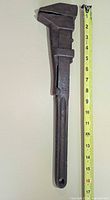 Full view of wrench with measuring tape showing length