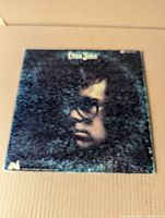 Front of gatefold jacket showing Elton John portrait