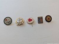 All five pins arranged in a row for overview