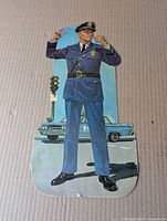 Police officer die-cut figure with patrol car background