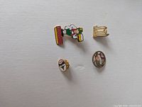 Group shot of four enamel lapel pins