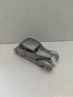 Front left view of silver die-cast 1935 Chevrolet Show Rod