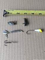All lures lined under measuring tape