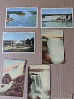 Fronts of five of six Niagara Falls postcards