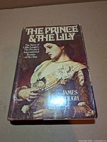 Front view of hardcover with dust jacket displaying title and author