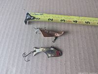 Both lures with tape measure showing sizes