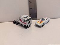 Semi truck cab and Corvette Stingray side by side