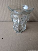 front view of clear glass Paul Revere bust candle holder