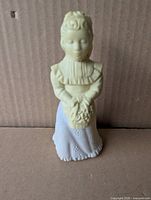 Front view of Avon Wedding Flower Maiden figural perfume bottle