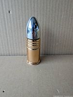 Front view of bullet-shaped Avon Wild West aftershave decanter