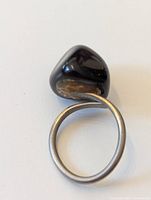Ring with black glass stone and silver-tone band – full view