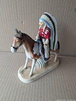 Front left view showing chief, horse detail, overall form