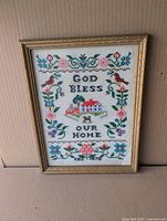 Full view of framed cross-stitch sampler