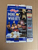 Front of flattened Kellogg's Mini-Wheats Star Trek TNG cereal box showing characters and promotion