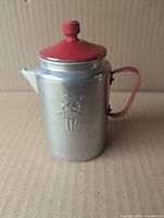 Front view showing embossed Little Bo Peep and overall teapot form