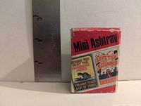 Front of cardboard box labeled Mini Ashtray with cartoon graphics