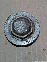 Top view of hex head and flange showing wear and rust