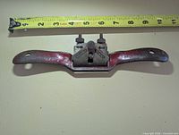 Front view of Record A151 spokeshave with tape measure showing length
