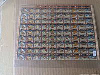 Front view of nearly complete sheet showing full array of 100 charity seals