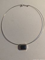 Full view of choker necklace laid flat