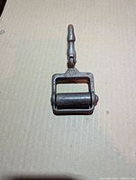 Full view of swivel snap hook with roller