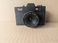 Front view showing TIME logo and LAYEC Optical Glass 50 mm f/6 lens