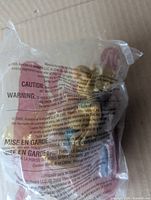 Front of sealed polybag showing Jibolba figure inside