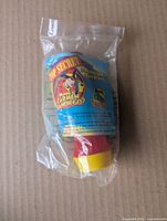 Front of sealed toy showing branded label and colours