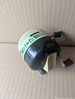Left side of Zebco 404 reel showing logo band and beige cone