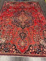 Full view of entire rug showing central medallion and field