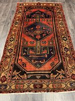 Full view of Persian Zanjan rug showing entire pattern and borders