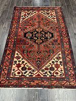 Entire rug laid flat showing full design and borders