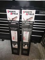 Front of two boxed Sports Afield 6'6" spinning combos